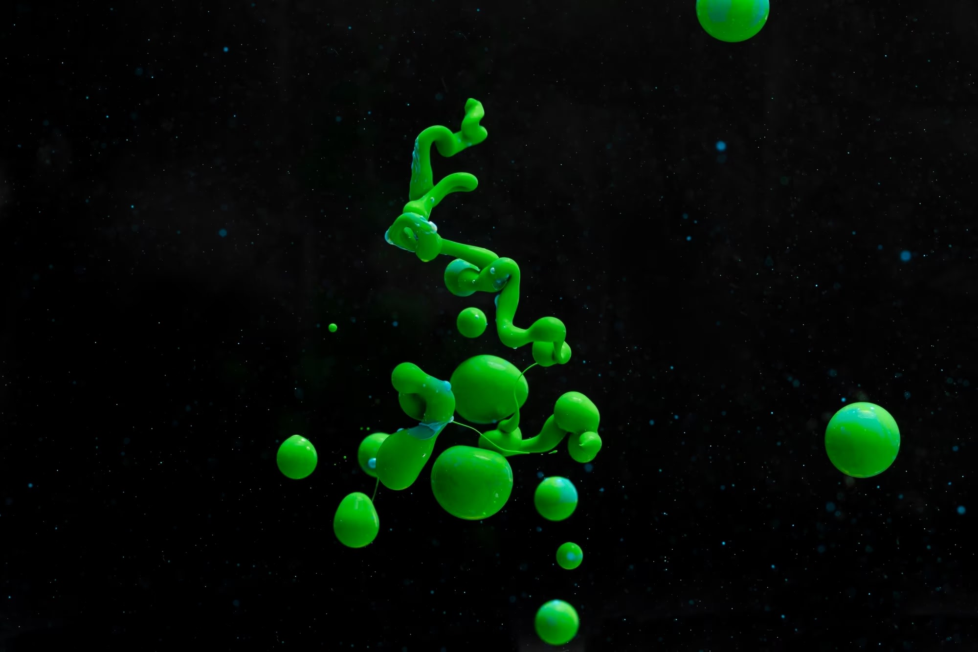 Abstract acrylic green liquid shapes on a black background