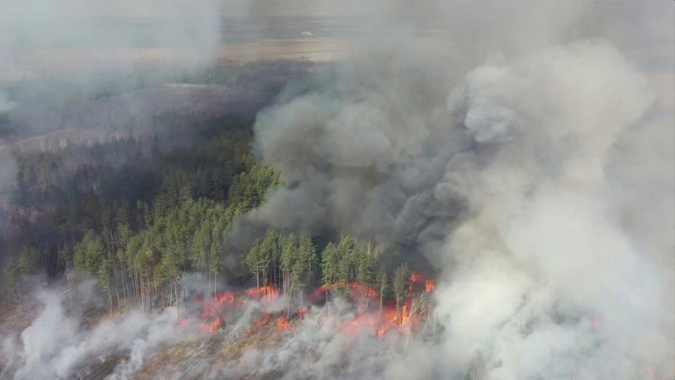 An aerial view shows a forest fire in the 30 km (19 miles) exclusion zone around the Chernobyl nuclear power plant, Ukraine, April 12, 2020.