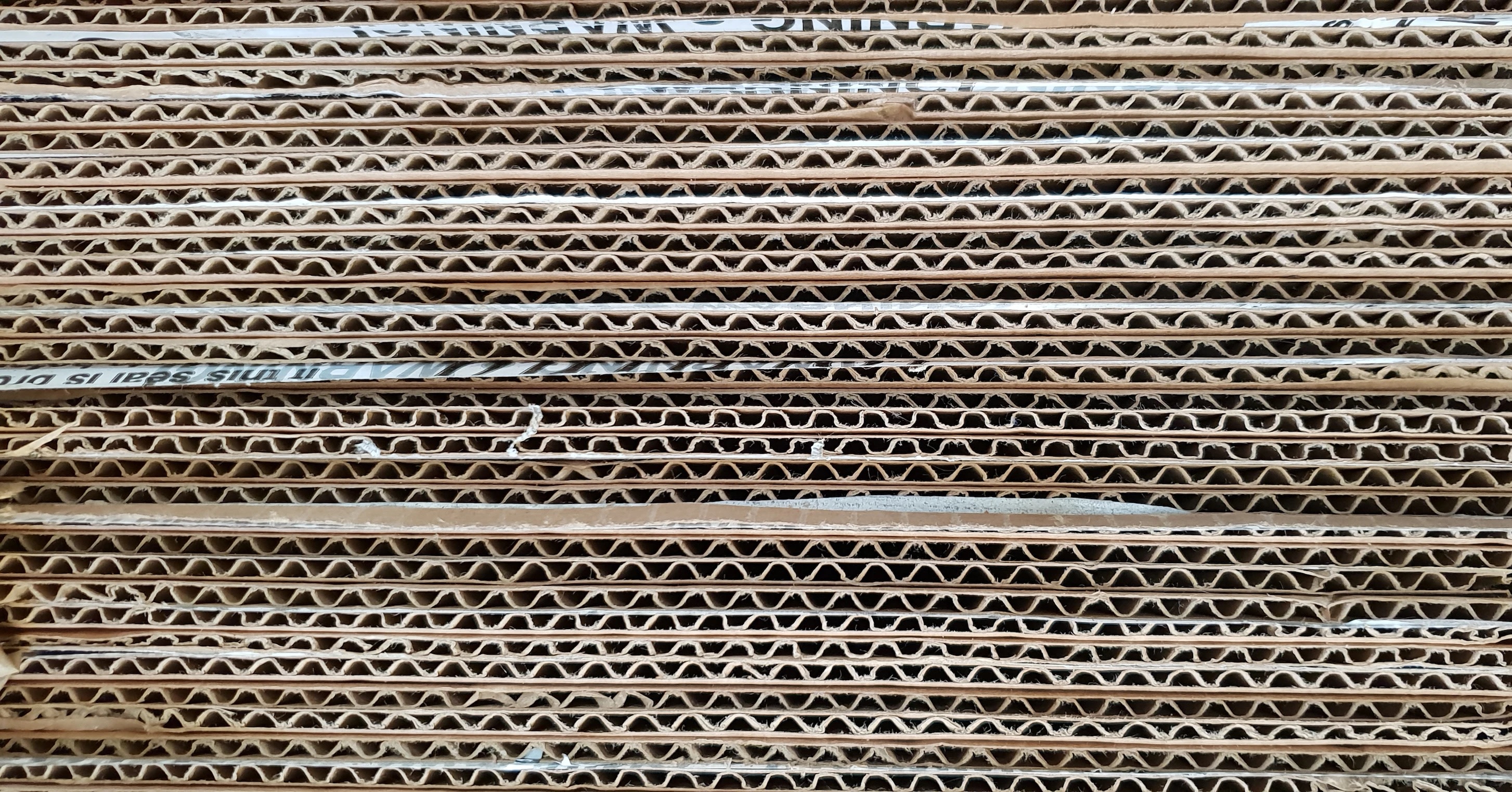 Image of stacked corrugated cardboard packing materials