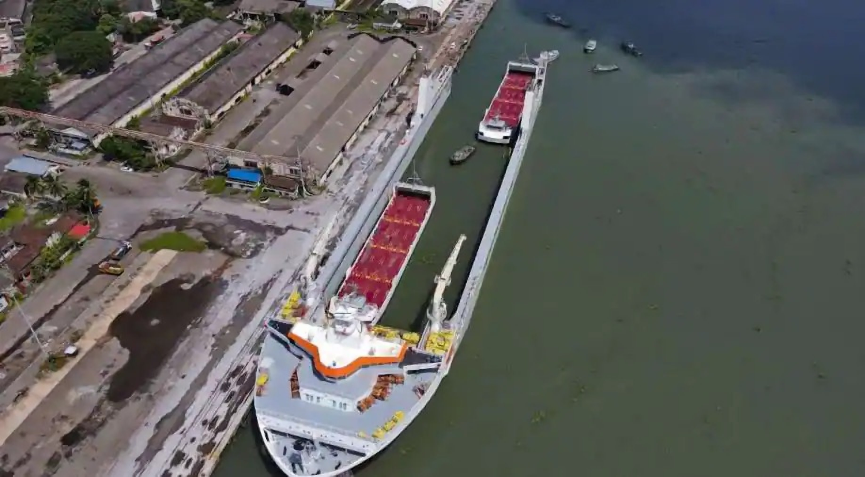 Two autonomous electric barges are being loaded onto Yatch Servant, a large vessel transporter to Norway, at Cochin Port in Kochi, India.