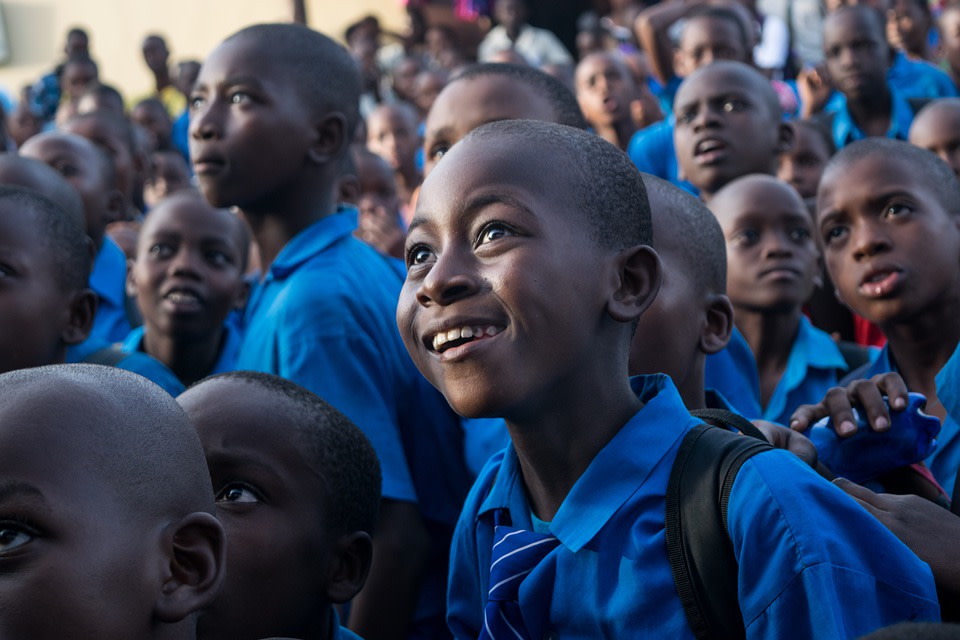 Children looking over an event 