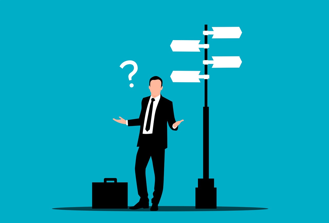 Graphic of suited businessman at decision crossroads
