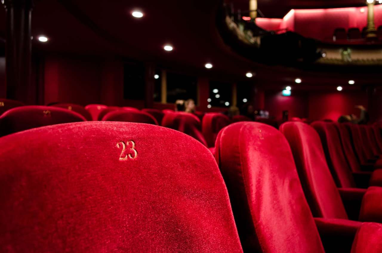 Row of red cinema chairs in cinema