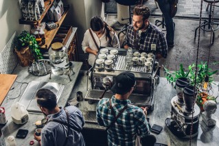 Men making coffee in a coffee shop