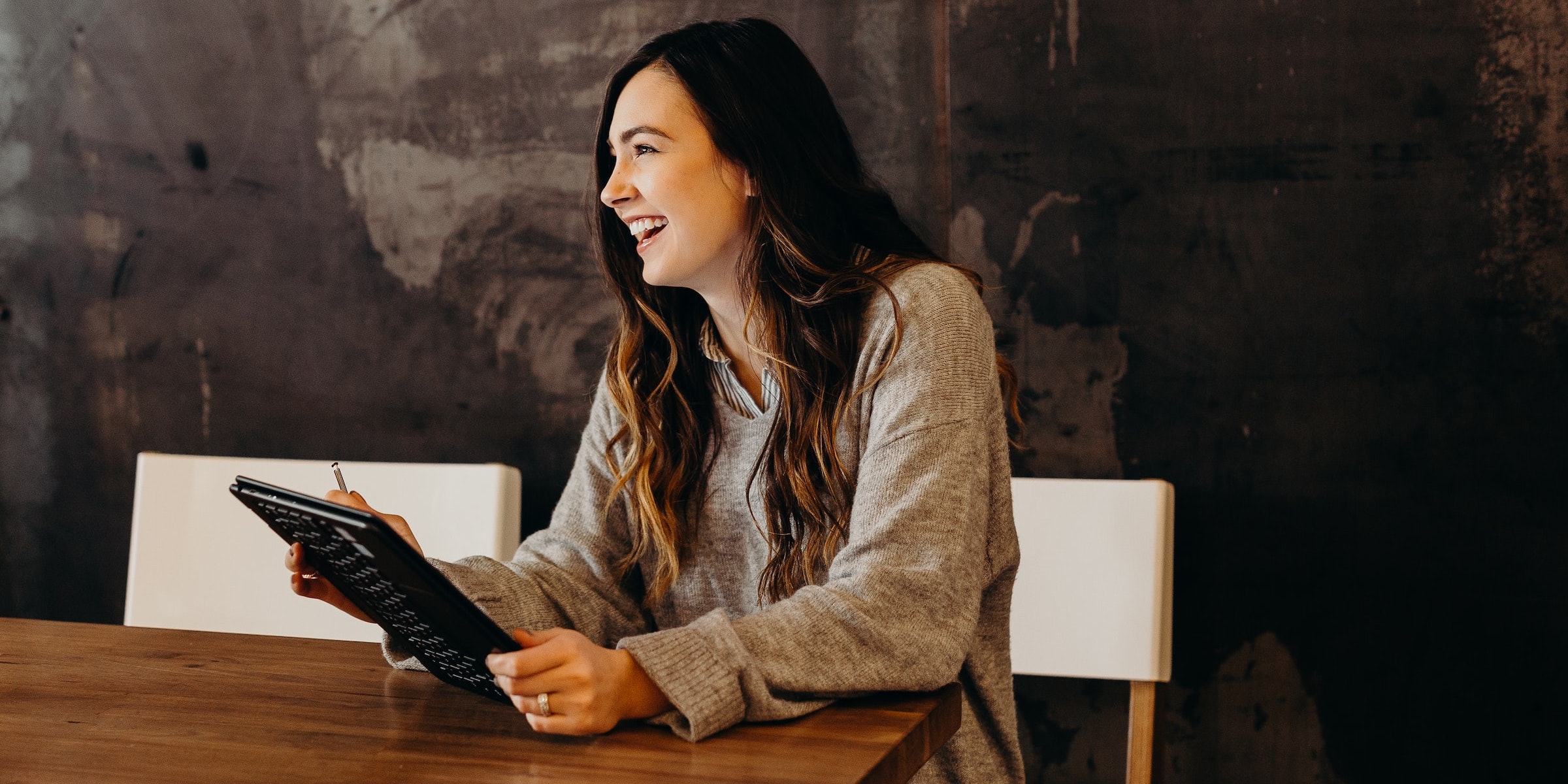 Woman smiling with smart tablet
