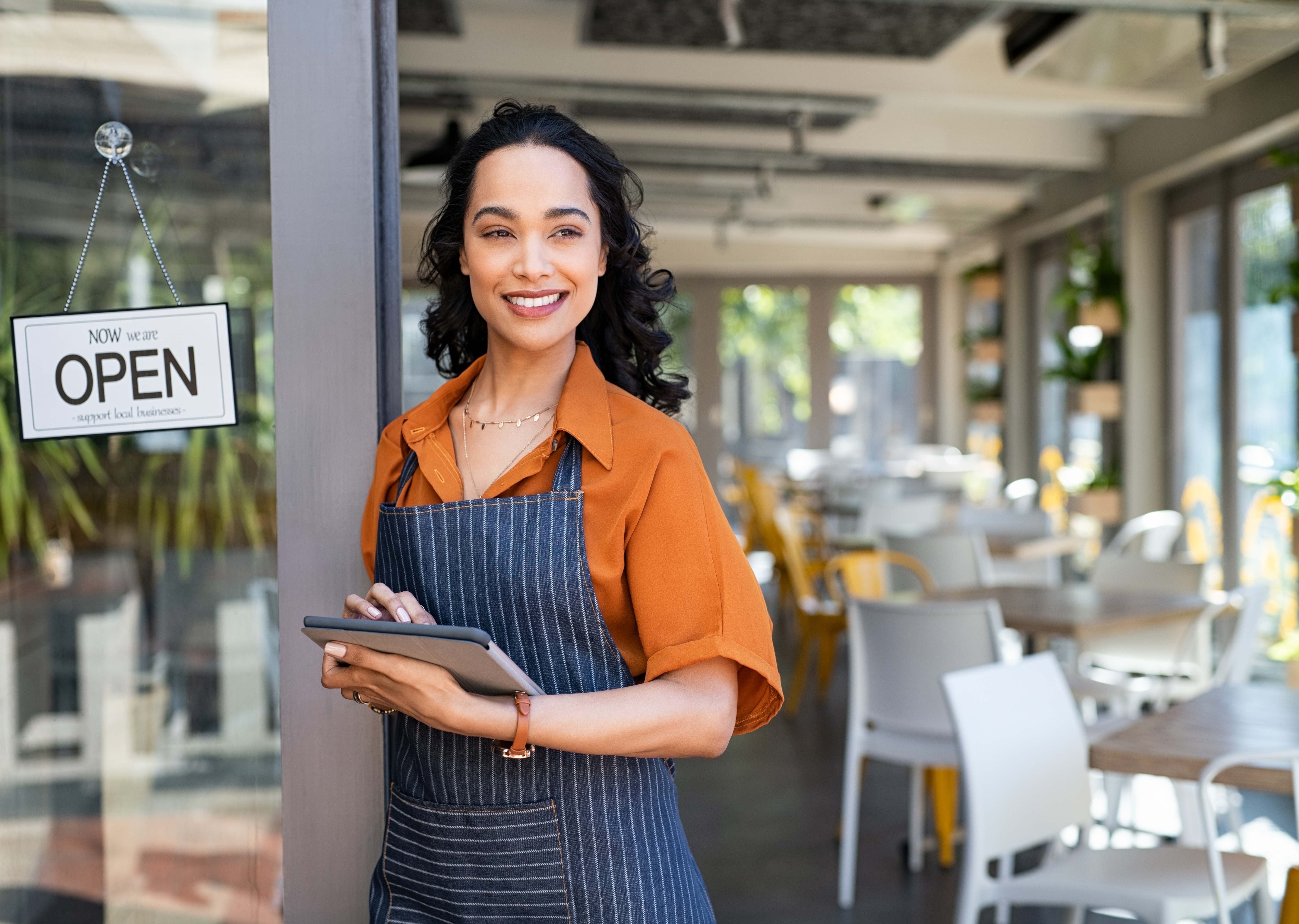 small-business-entrepreneur-at-cafe-entrance-using-2023-11-27-05-30-16-utc