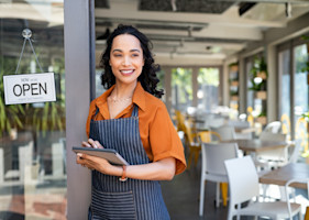 small-business-entrepreneur-at-cafe-entrance-using-2023-11-27-05-30-16-utc