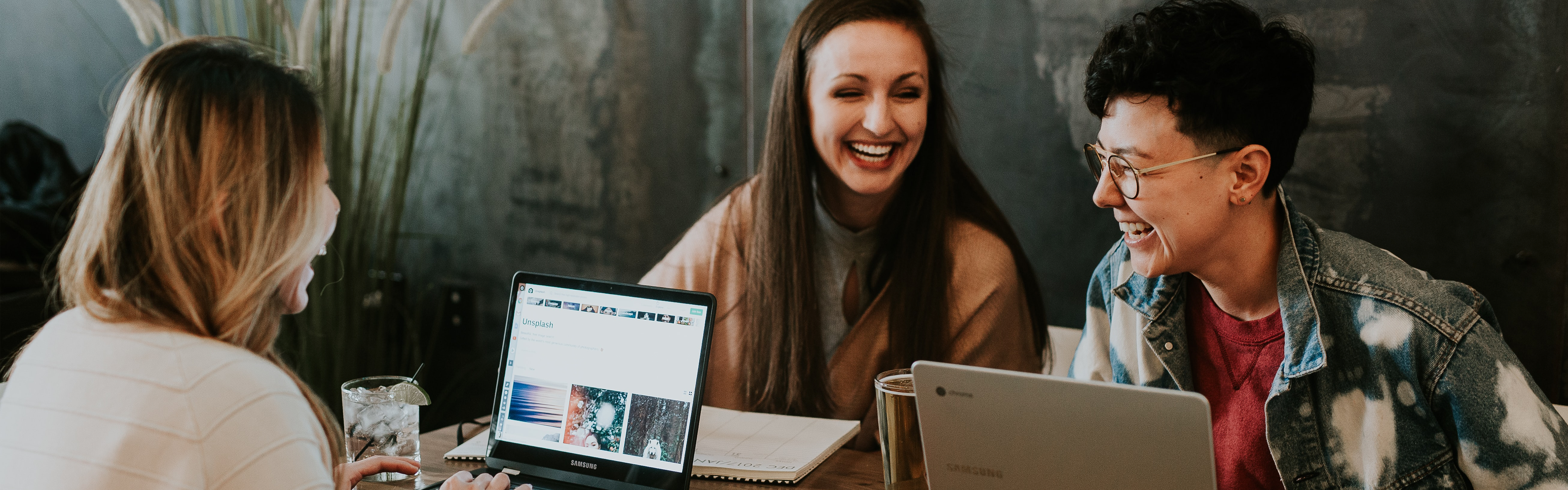 women working on laptops in office