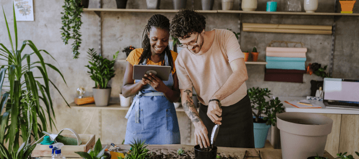 Woman and man working on plants