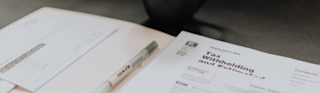 tax forms and pen