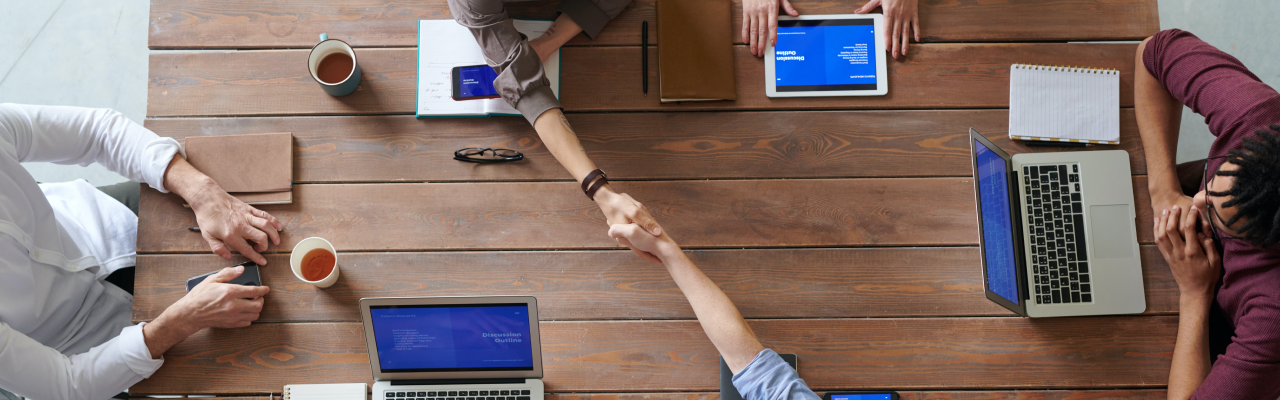 people having a business meeting around a table