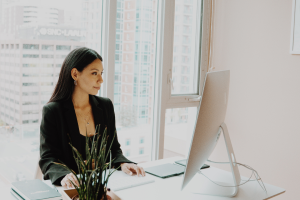 Woman working on laptop at desk