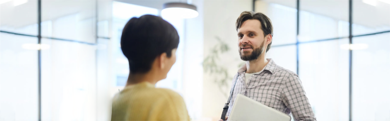 Mortgage broker at desk - wide image