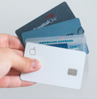 man holding credit card selection