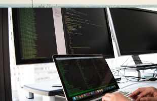 Person typing in code