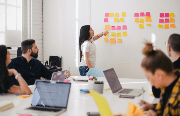 Woman teaching at board 