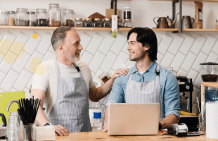 Valentine's Day image of two men in coffee shop working