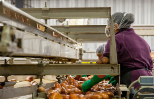 Woman Cleaning Sweet Potatoes