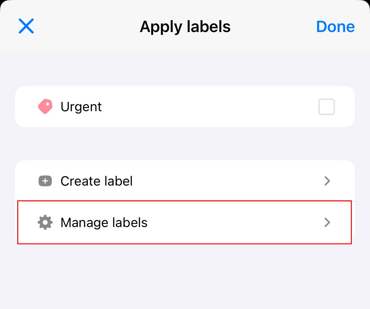 Menu Terapkan label akan terbuka di iOS dengan tombol Kelola label disorot.