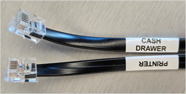 Labeled ends of the cash drawer cord