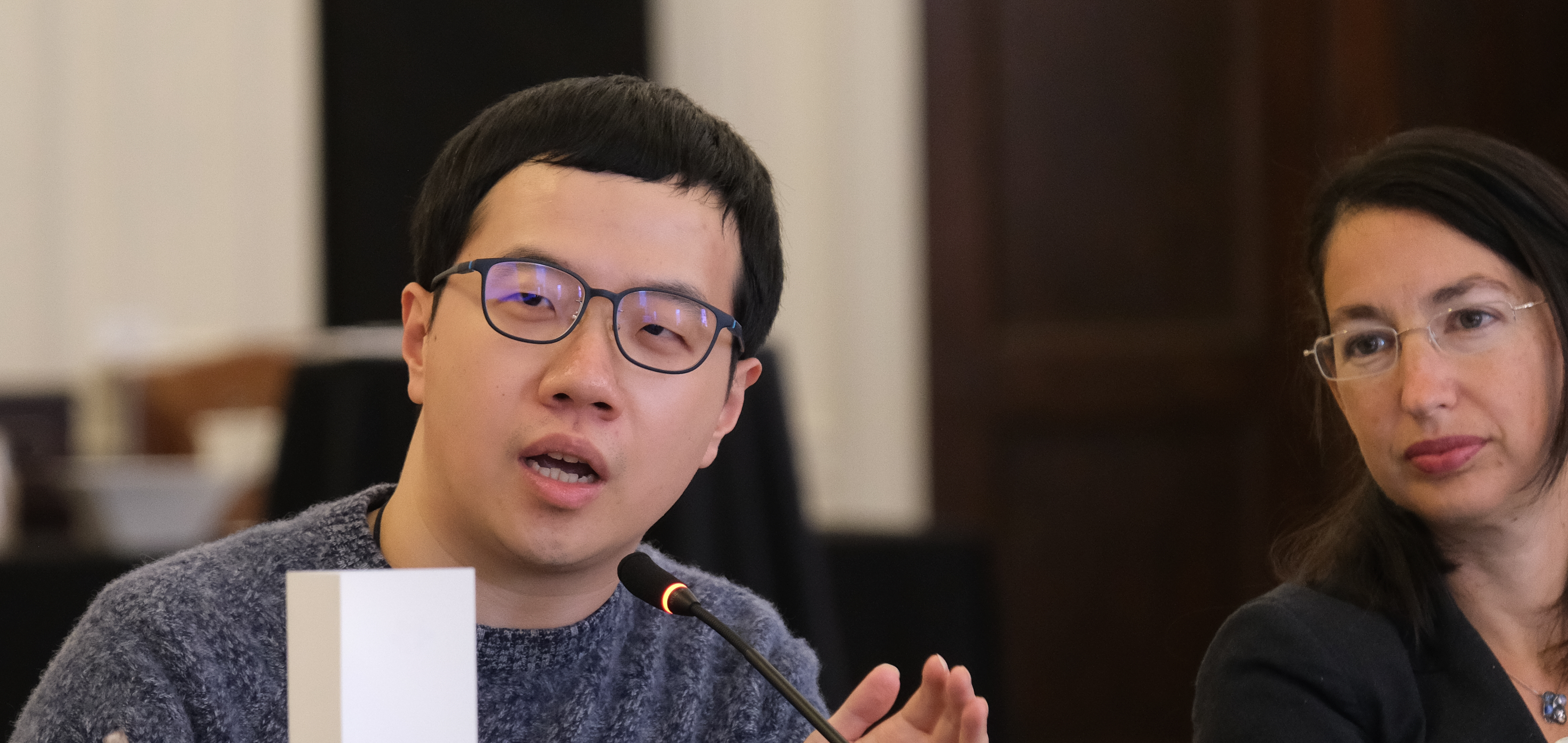 NYU Law student Junhao Chen discussing his paper