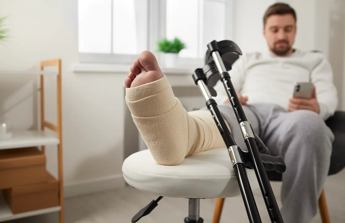Man with leg wrapped up due to injury.