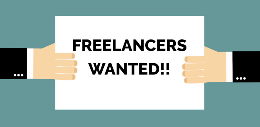 Two hands holding up a sign saying "freelancers wanted."