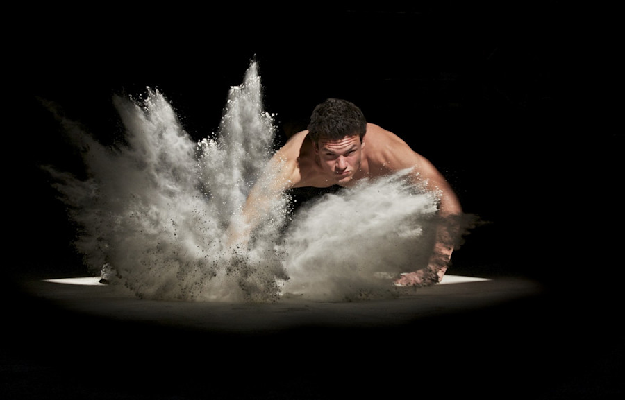 Man punching sand