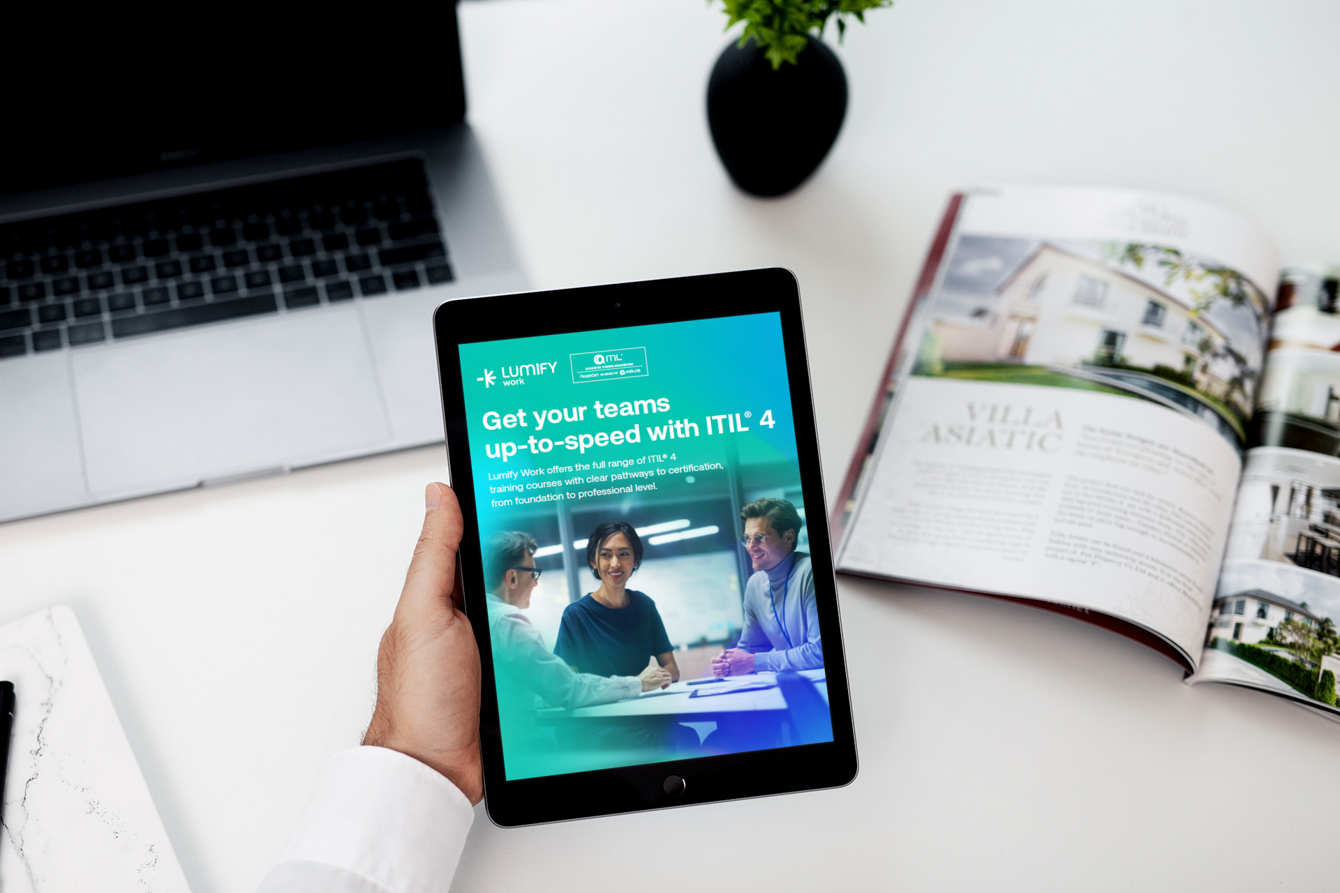 LFY - Work - eBook - ITIL - 2024 2.6 mockup-of-a-man-holding-an-ipad-mini-over-his-work-desk-2112-el