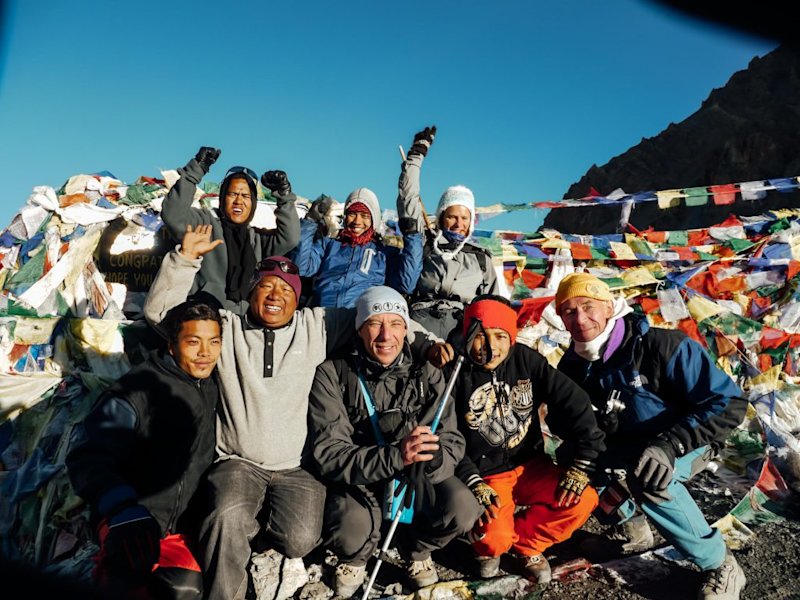annapurna circuit group celebrating at the top of Thorung La Pass!