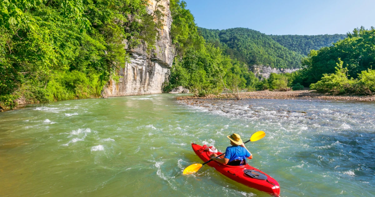 Man kayaking out in nature in Arkansas | Swyft Filings