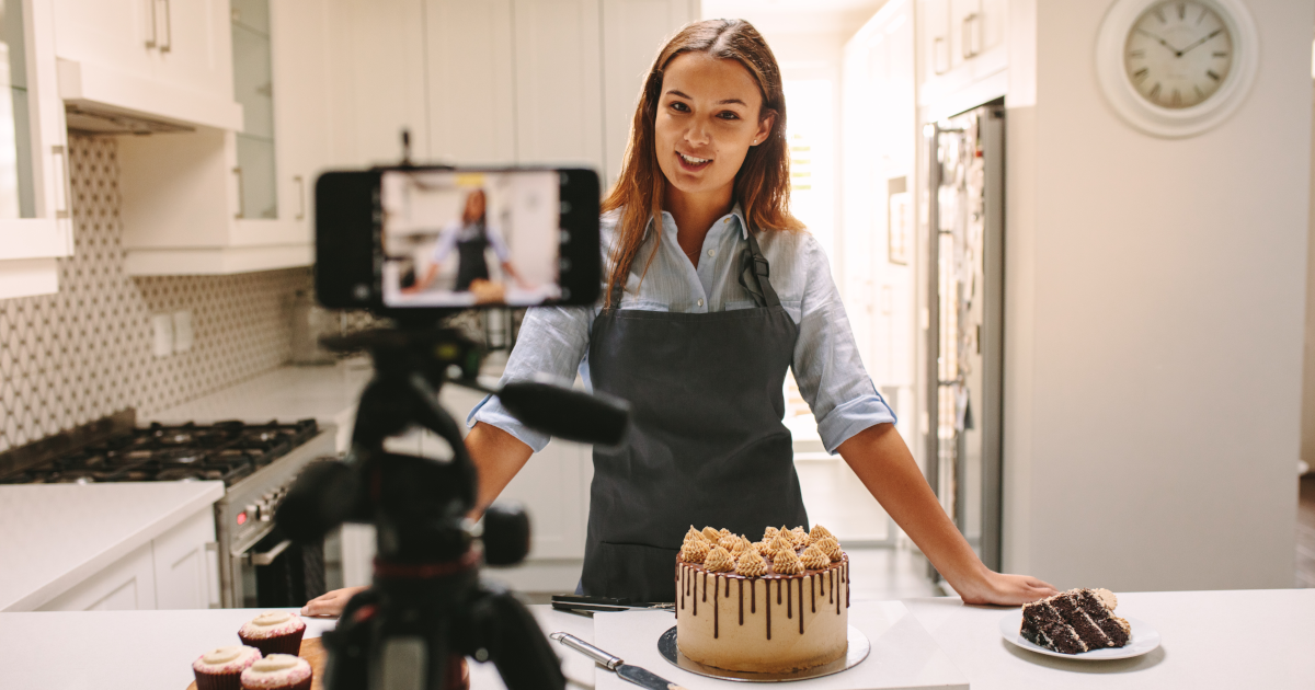 Woman filming her baking. 