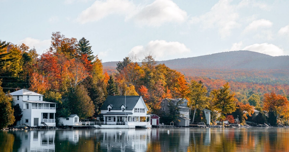 Houses on a lake in the fall in Vermont | Swyft Filings