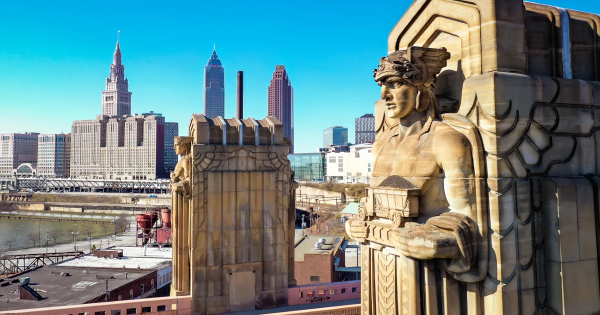 Statue of man overlooking downtown Cleveland, Ohio | Swyft Filings