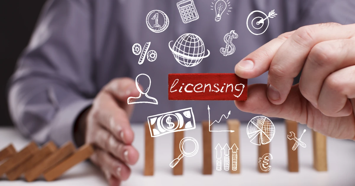 Young businessman shows the word licensing