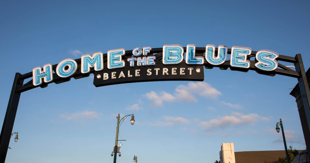 A sign reading "Home of the Blues" on Beale Street in Tennessee | Swyft Filings