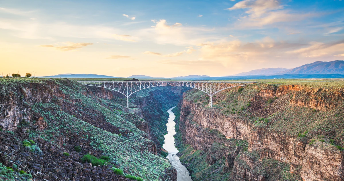 Taos, New Mexico, USA at Rio Grande Gorge Bridge over the Rio Grande at dusk