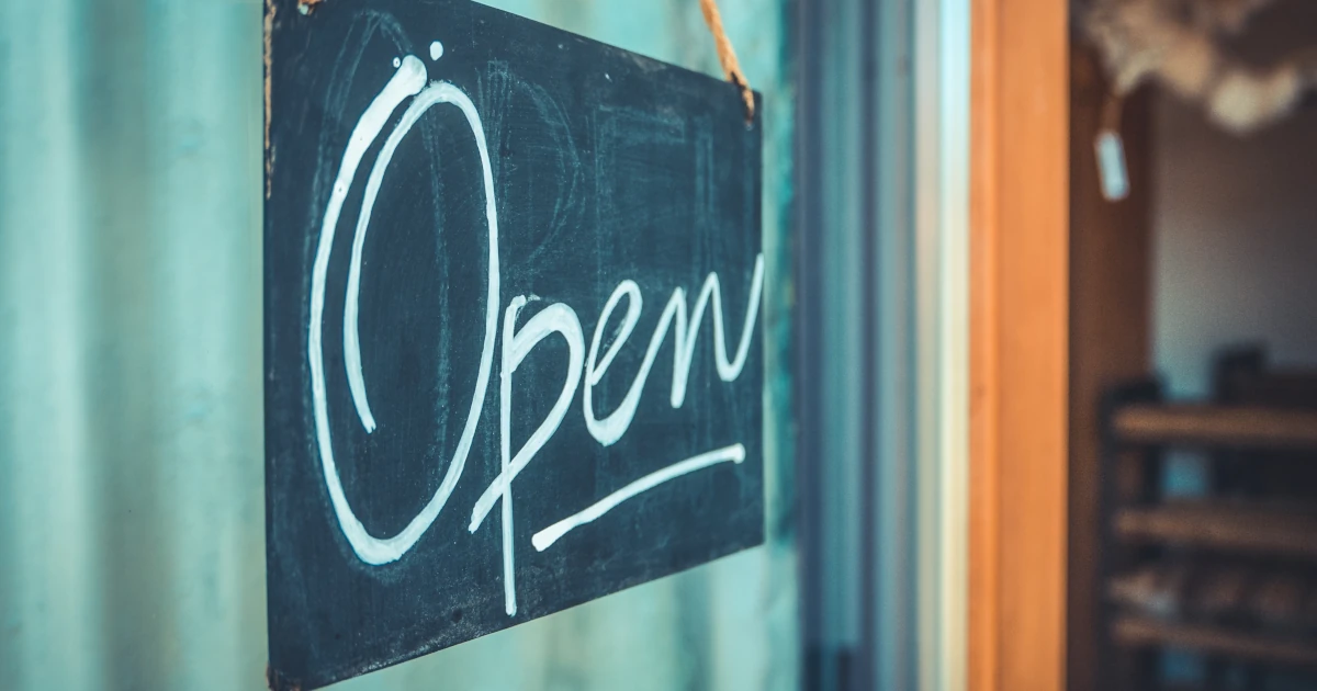 Rustic Open Sign Hanging In The Door Of A Coffee And Gift Shop In Oregon