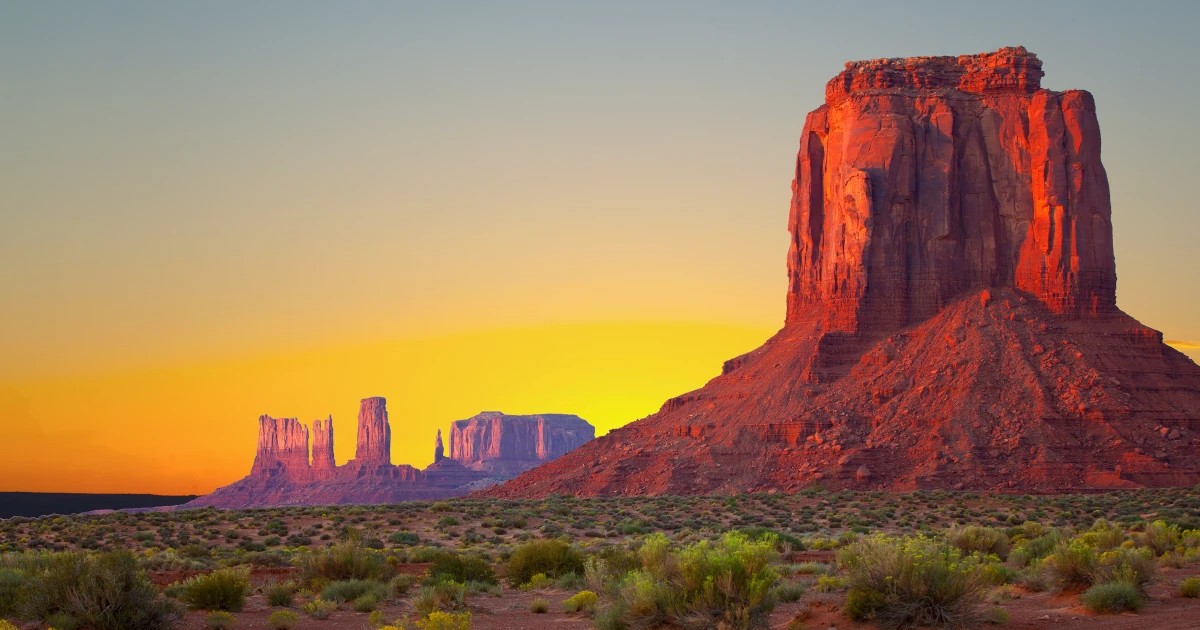 A rock formation seen at sunrise in Arizona's Monument Valley | Swyft Filings