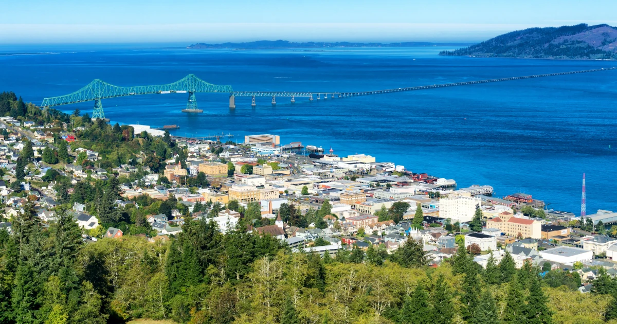 A view of the coast of Oregon with a bridge in the background | Swyft Filings