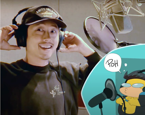 Behind-the-scenes shot of Steven Yuen recording an episode