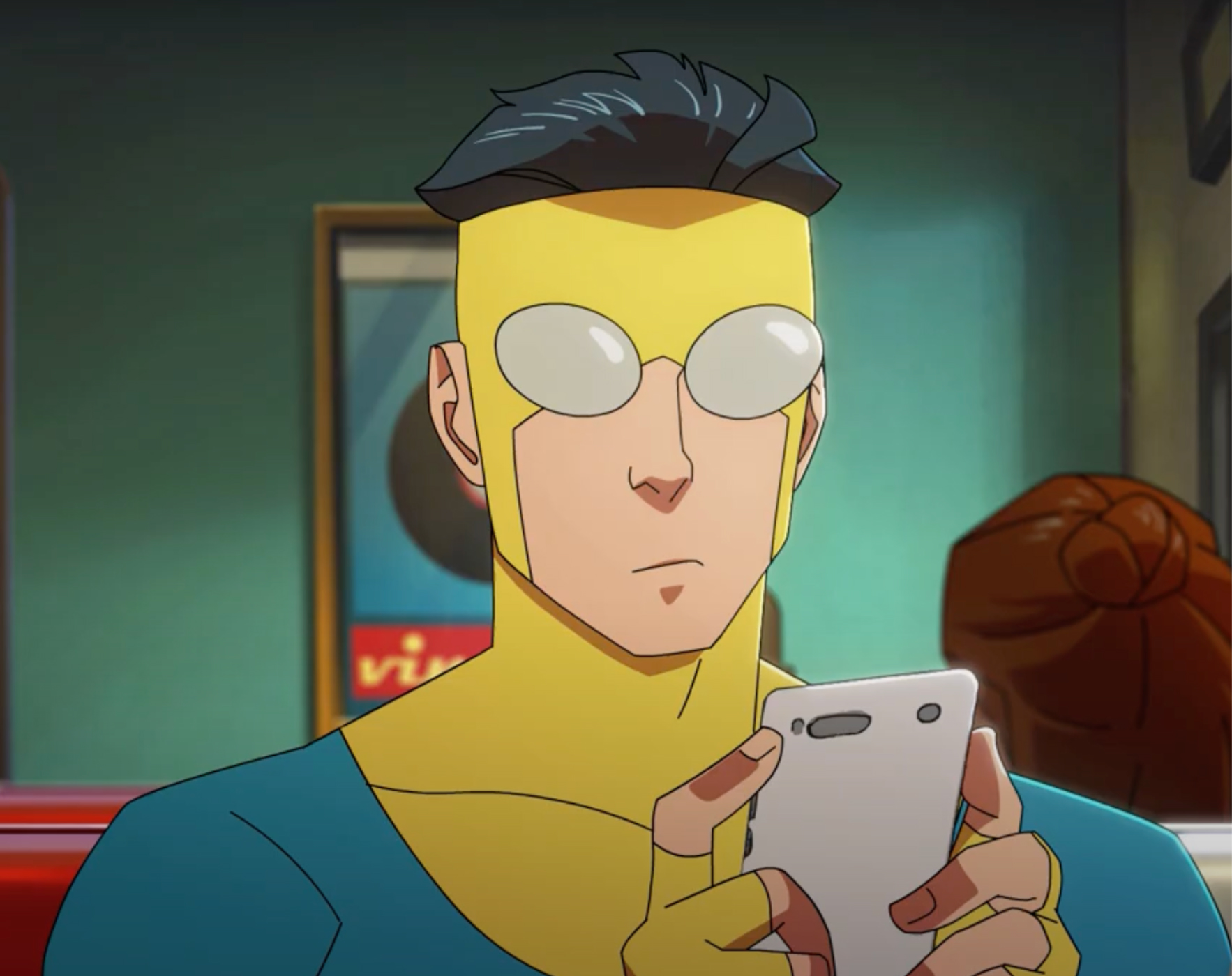 Invincible sitting in Burger Mart holding his phone