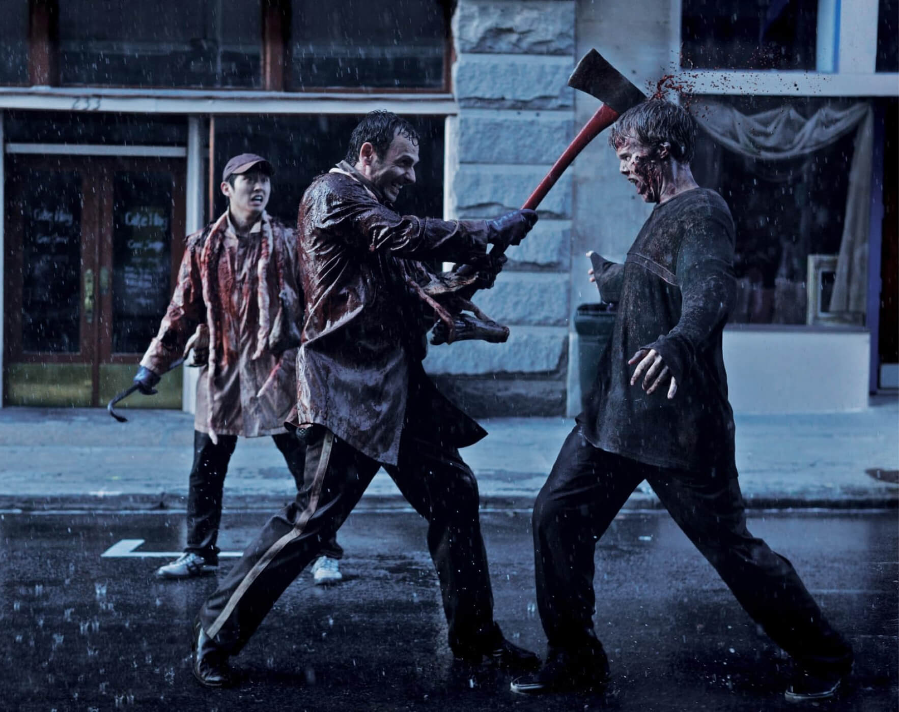 Rick swinging an axe into a walker's head