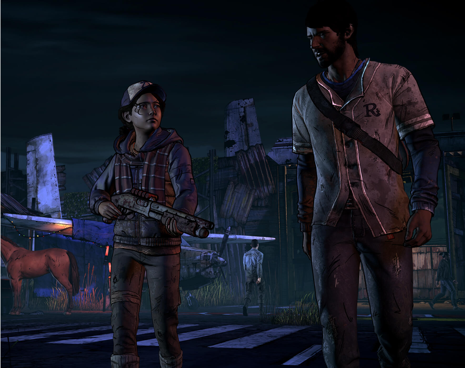 Gameplay characters, Clementine and Javier, standing in an empty lot holding weapons