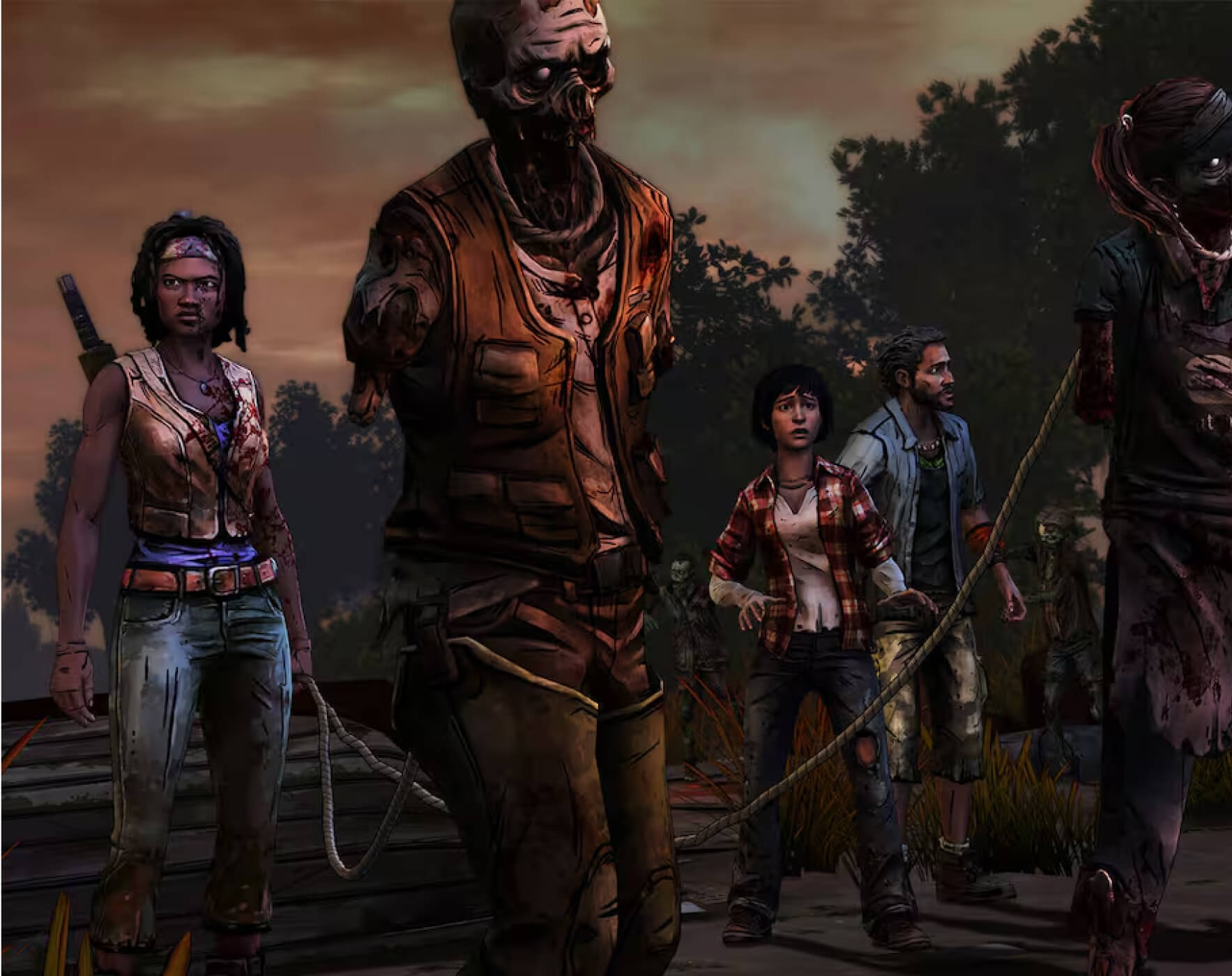 Michonne walking with a group while holding a rope that is tied to the necks of two walkers in front of her.