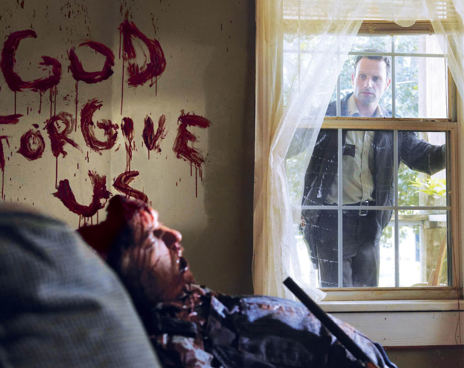 Rick looking through a window of a house with "god forgive us" written in blood on the wall