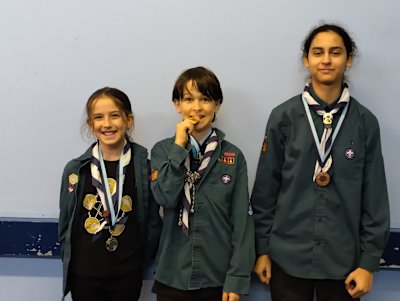 The Bronze, Silver and Gold medal winners of the group's shooting competition earlier this year look rather pleased. The gold winner is cheekily biting his medal.