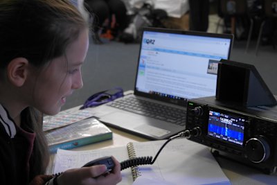 A Scout is learning how to contact other Scouts using amateur radio. She's managed to reach a Scout in Sweden!