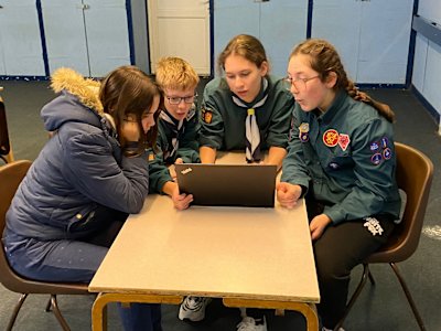 This group of four Scouts seem really interested in what they've found out on the group's new laptop.