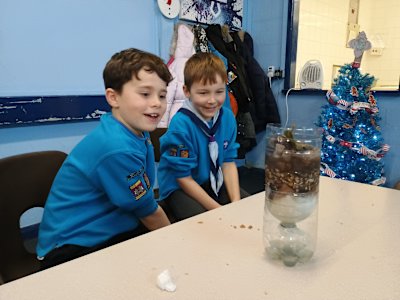 These two Beavers look amazed at the clear water their filter is producing from the filthy water that was poured into it.